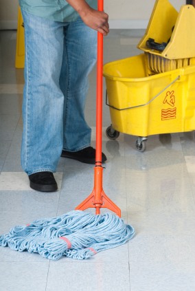 The Fifth Labor Buffalo LLC janitor in West Falls, NY mopping floor.